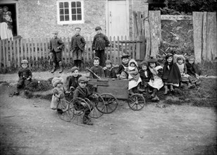 Children with go-carts at Greatworth, Northamptonshire, 1901