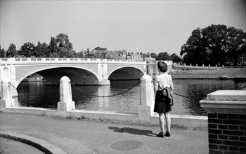 Woman admiring Hampton Court Bridge, London, c1945-c1965