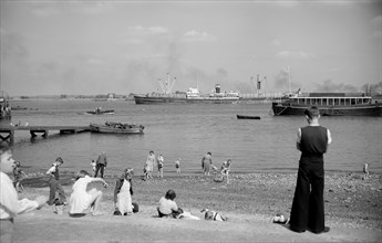 People on the beach at Gravesend, Kent, c1945-c1965