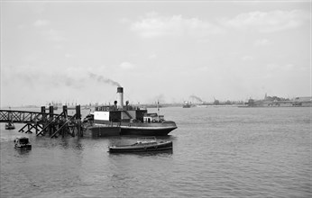 A car ferry unloads at Gravesend, Kent, c1945-c1965