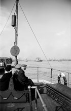 A view of shipping near Gravesend, Kent, from the stern of a passenger ferry, c1945-c1965