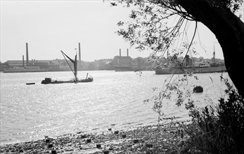 A Thames sailing barge on the River Thames at Tilbury, Essex, c1945-c1965
