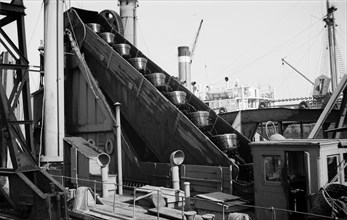 Detail of a dredger at work in Tilbury Docks, Essex, c1945-c1965