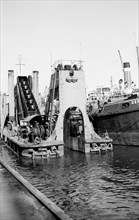A dredger at work in Tilbury Docks, Essex, c1945-c1965