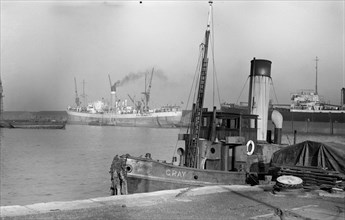 A small boat, the 'Gray', in Tilbury Docks, Essex, c1945-c1965