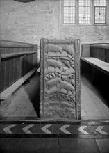 A pew end in St Nonna's church, Altarnun, Cornwall, 1957