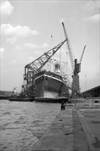 A ship moored in London docks, 1937