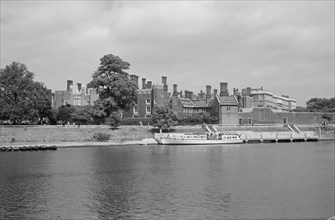 Hampton Court Palace, viewed from the south bank of the River Thames, c1945-c1965