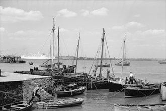 Men working on Bawley boats moored at a quay at Gravesend, c1945-c1965