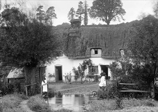 A thatched cottage by the stream, Ramsbury, Wiltshire, c1860-c1922