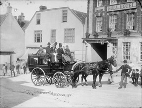 Horse drawn bus with passengers outside the Bull Hotel, Burford High Street, Oxon, c1860-c1922