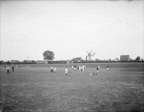 Boys playing cricket, with Thame windmill in the background, Thame, Oxfordshire, c1860-c1922