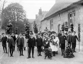 A group of children on May Day with May King and Queen centre right, Oxford, Oxfordshire, c1900