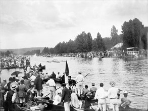 Crowds watch a race during the Henley Regatta, Henley-on-Thames, Oxfordshire