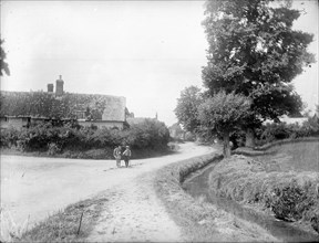 Small boy and a donkey on a road leading into Chalgrove, Oxfordshire, c1860-c1922