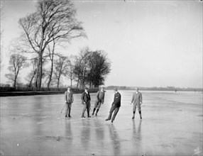 Men playing ice hockey on the frozen Medley Port Meadow, Oxford, Oxfordshire, c1860-c1922