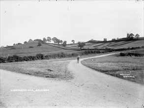 A farm labourer walking to work near Hellidon, Northamptonshire, c1873-c1923