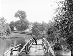 A man leaning on the handrail of the last footbridge, Iffley, Oxford, Oxfordshire, 1885