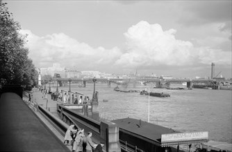 A view of Hungerford Bridge and River Thames, Lambeth, London, c1945-1965