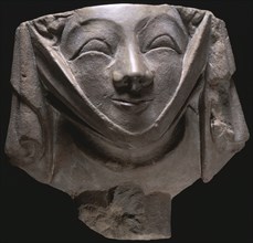 Stone corbel in the shape of a smiling nun, medieval, 14th century. Artist: Unknown