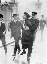 Emmeline Pankhurst arrested by Superintendent Rolfe outside Buckingham Palace, London, May 1914. Artist: Unknown