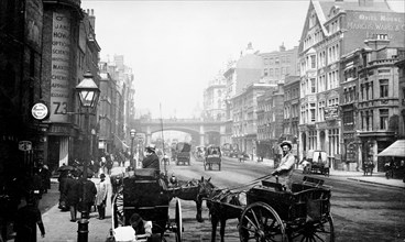 People walking down Farringdon Street looking towards Holborn Viaduct, City of London, 1890. Artist: Unknown