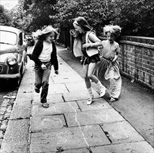 Children playing hopscotch on a London street, c1970. Artist: Henry Grant