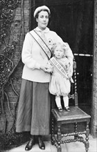Rose Lamartine Yates wearing the suffragette uniform, with her son Paul, Surrey, c1910. Artist: Unknown