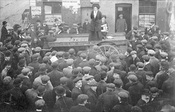 Isabel Seymour addressing a crowd of men and boys from a tradesman's cart, 1908. Artist: Unknown