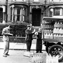 A milkman on his rounds in London, c1950s. Artist: Henry Grant