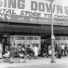 Shoppers attending a closing down sale at a shop in Kentish Town, London, c1970. Artist: Henry Grant