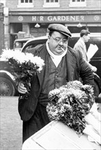 A London flower seller, Covent Garden Market, 1952. Artist: Henry Grant