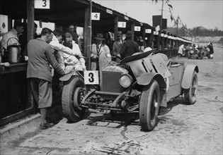 Dudley Froy with the 4.5 litre Invicta S type, at Brooklands, Surrey, 1931. Artist: Unknown