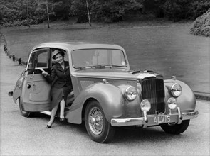 Woman in a 1954 Alvis 3 litre TC 21, (late 1950s?). Artist: Unknown
