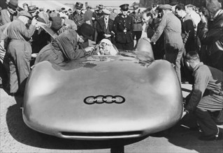Bernd Rosemeyer and Ferdinand Porsche with Auto Union, c1937-c1938. Artist: Unknown