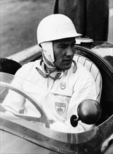 Stirling Moss at Goodwood, 1954. Artist: Unknown