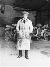 DF Bentley standing in front of a Bentley car, 1921. Artist: Unknown