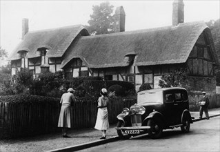 1933 Triumph Super Nine Saloon at Anne Hathaway's cottage, Shottery, Warwickshire, c1933. Artist: Unknown