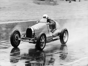 Frank Wall driving a Bugatti Type 35B, 1926. Artist: Unknown