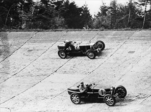 Maserati and Bugatti in action at Brooklands, Surrey, 1933. Artist: Unknown