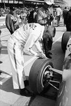 Technician checking tyre wear, Indianapolis, Indiana, USA, 1965. Artist: Unknown