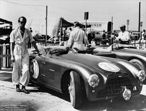 Peter Collins with an Aston Martin, Sebring, Florida, USA, 1950s. Artist: Unknown