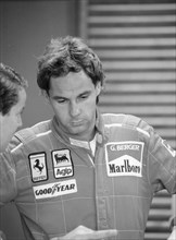 Gehard Berger listening to a member of the Ferrari team, 1988. Artist: Unknown