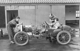 Amherst Villiers and a mechanic taking the revs of a Bugatti Cordon Rouge, c1920s. Artist: Unknown