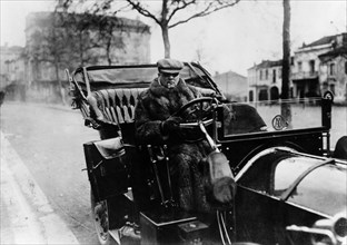 Lord Northcliffe at the wheel of a 1908 135 hp Mercedes, (c1908?). Artist: Unknown