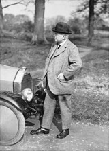 Victor Holroyd with a Triumph car. Artist: Unknown