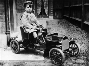 Boy in 1908 Mercedes 28/32 hp pedal car, c1908. Artist: Unknown
