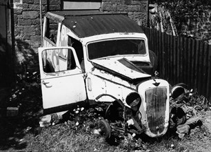 Wreck of a 1939 Austin 10. Artist: Unknown