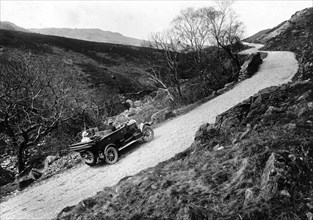 A Morris Oxford climbing a steep hill in the Lake District, Cumbria, (c1920s?). Artist: Unknown