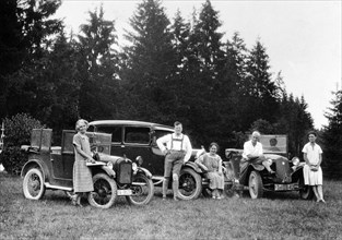 A group of people on an outing with their cars, c1929-c1930. Artist: Unknown